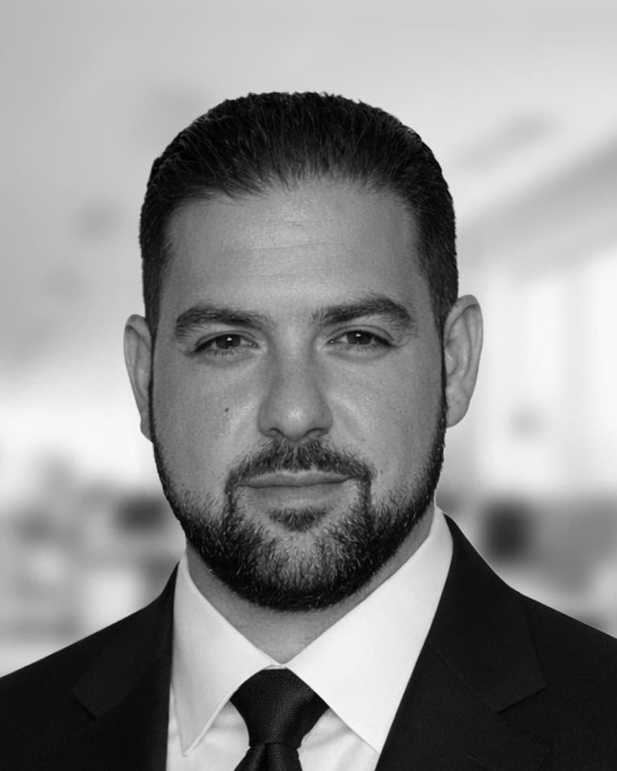 Kosta Sarakinis in a dark suit and tie